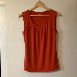 Orange sleeveless top. Medium.